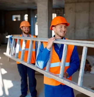 Construction workers carrying a ladder.